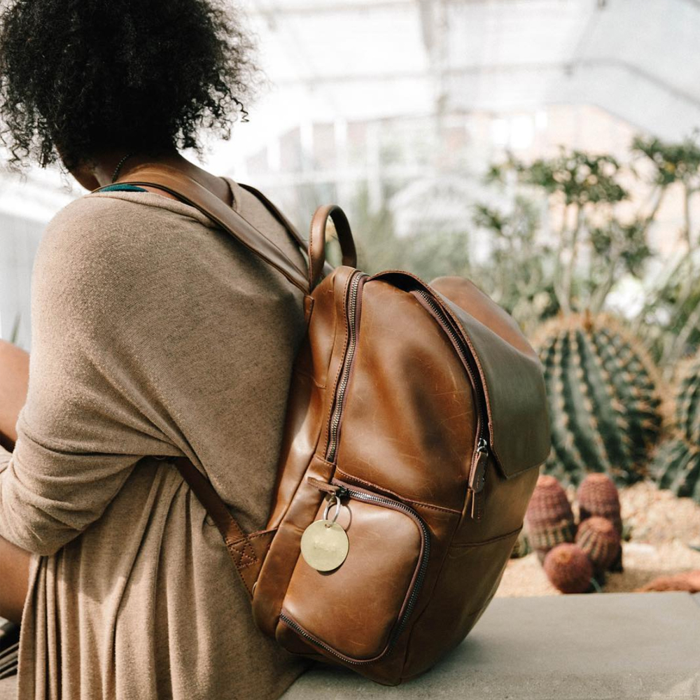 Woman wearing a genuine leather backpack